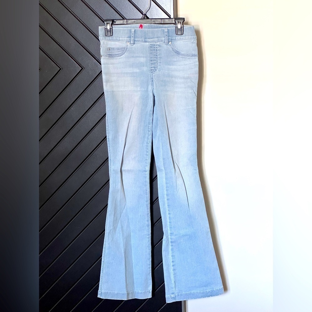 Spanx jeans in light shade. Flared bottom. Size petite small. Almost NEW!